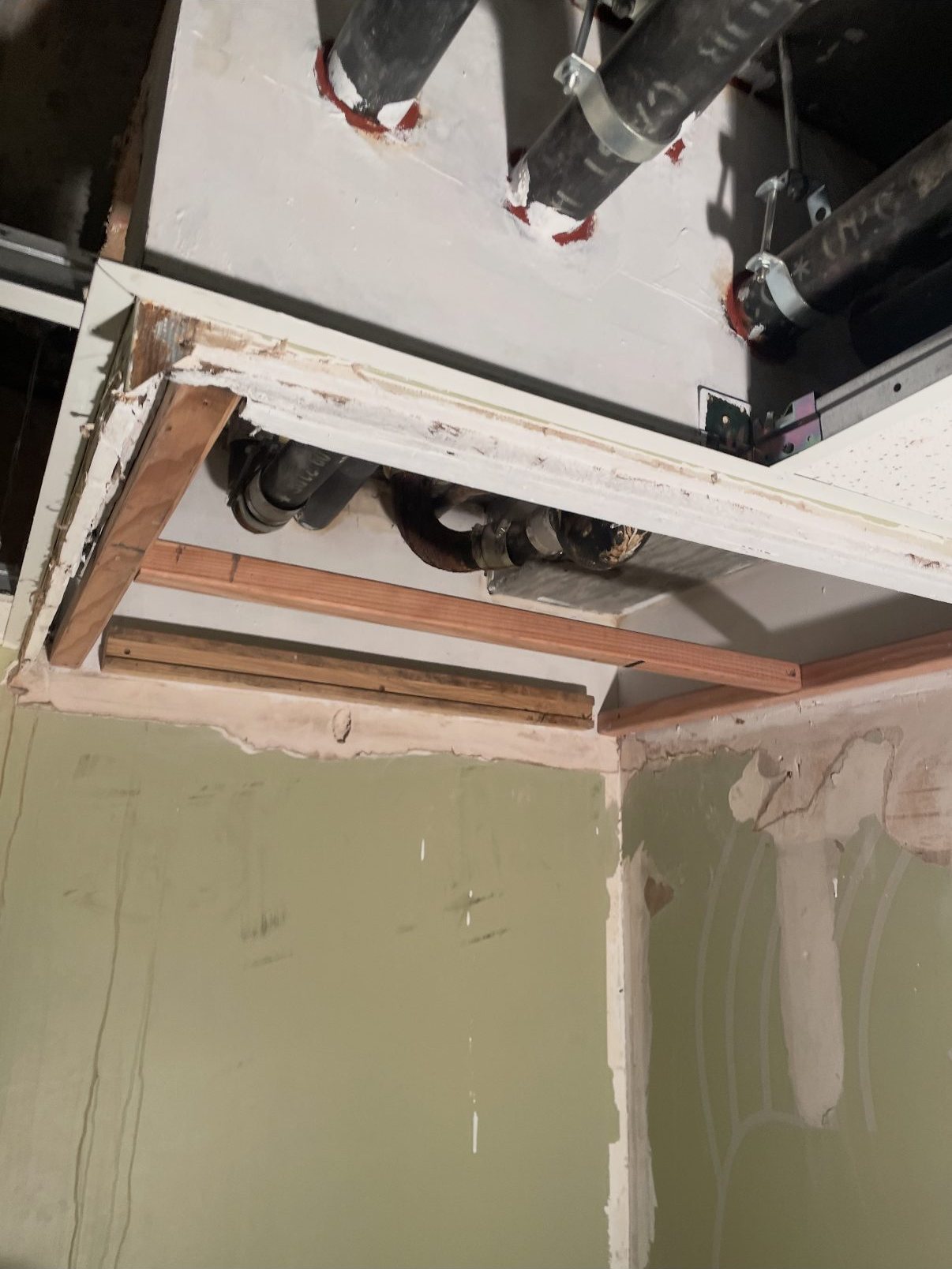 New timber framing installed around the repaired ceiling opening