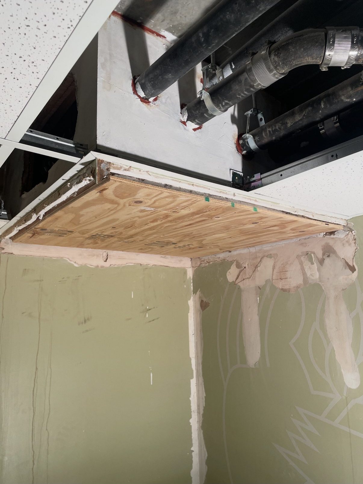 New plywood substrate installed over the repaired framing